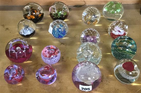 16 Caithness titled glass paperweights